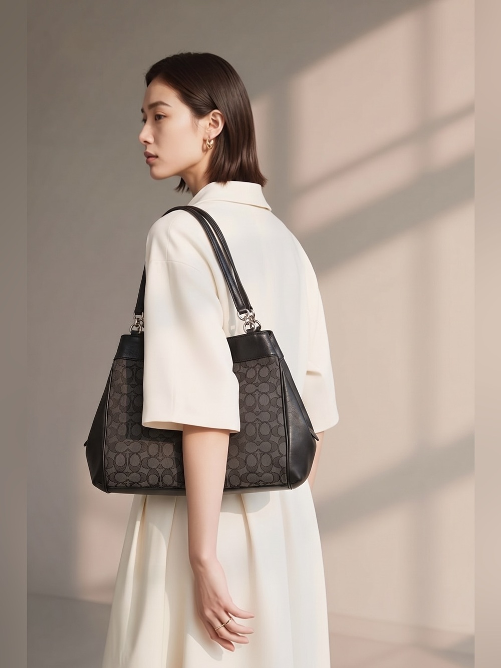 Coach Handbag in Canvas/ Leather With Silver color Hardware